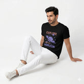 Man wearing a black t-shirt with space-themed design sitting on a white background