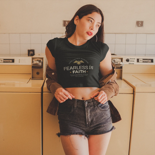 Woman wearing a black t-shirt with text in a laundry room
