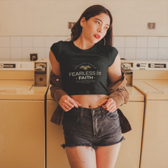 Woman wearing a black t-shirt with text in a laundry room