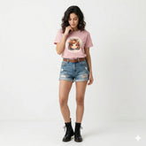 Girl in pink t-shirt with a graphic design on a soccer field