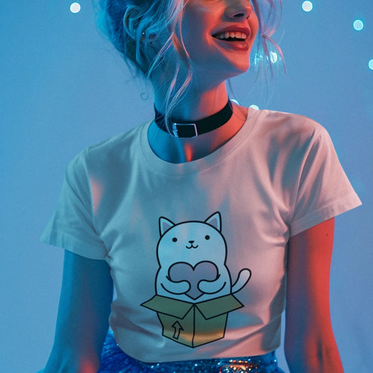 Person wearing a white t-shirt with a cat graphic against a blue background
