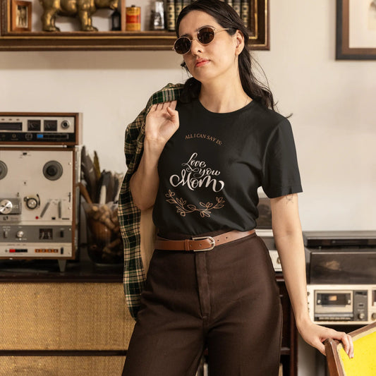 Woman wearing a black t-shirt with text in a vintage kitchen setting