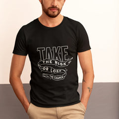 Man wearing a black t-shirt with motivational quote, standing against a neutral background.