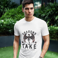 Man wearing a white t-shirt with a dragon graphic and text, standing outdoors.