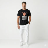Man wearing a black t-shirt with 'Good Vibes Only' text and a hand gesture symbol on a white background