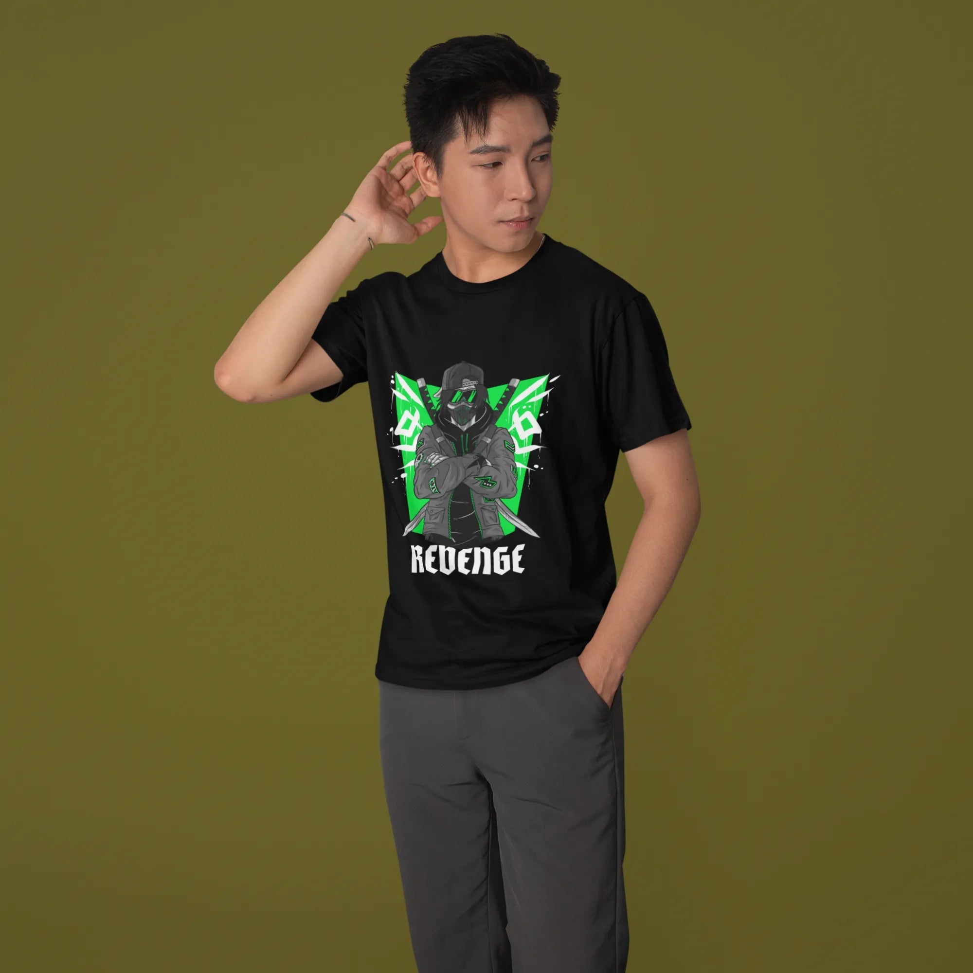 Person wearing a black t-shirt with a graphic design on a green background