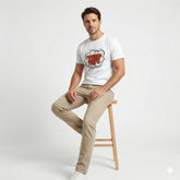Person wearing a white t-shirt with 'Thinking About You' text design.
