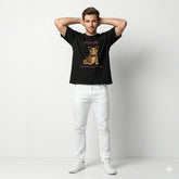 Man wearing a black t-shirt with a graphic of a dog and text, standing against a white background