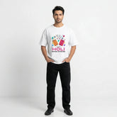 Man wearing a white t-shirt with colorful graphics and text on a white background