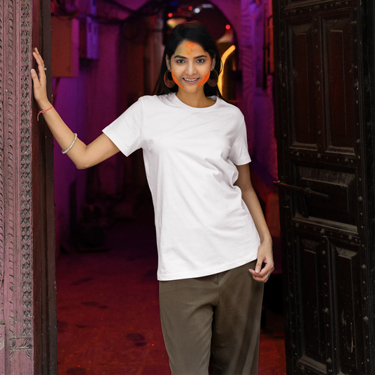 Woman standing in a doorway with a neon sign in the background