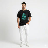 Man wearing a black t-shirt with teal text on a white background