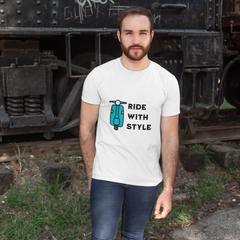 Man wearing a white t-shirt with a graphic and text, standing in front of a vintage train.