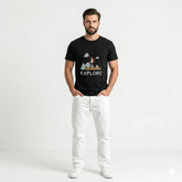 Man wearing a black t-shirt with a graphic design and the word 'EXPLORE', standing against a white background.