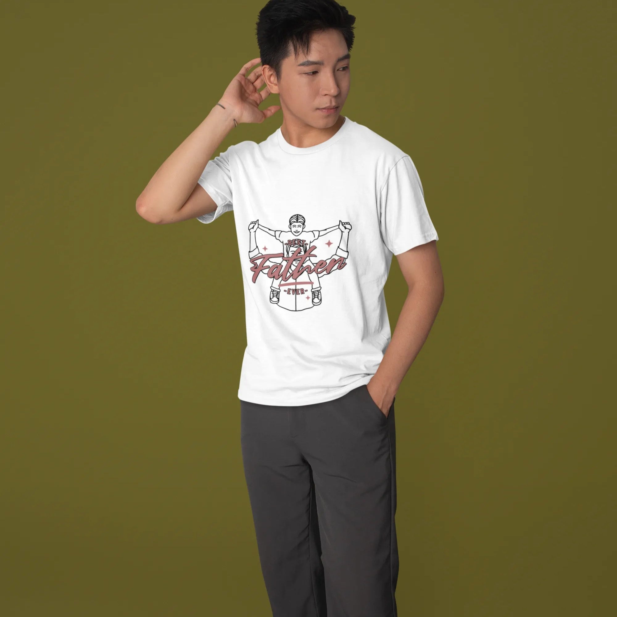 Person wearing a white t-shirt with graphic design on a green background