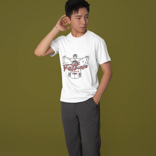 Person wearing a white t-shirt with graphic design on a green background