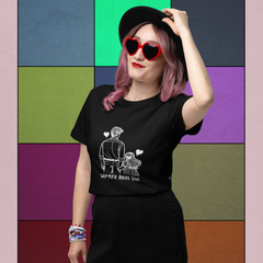 Person wearing a black t-shirt with a graphic design against a colorful geometric background