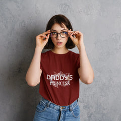 Woman wearing a red t-shirt with 'Daddy's Princess' text against a gray background