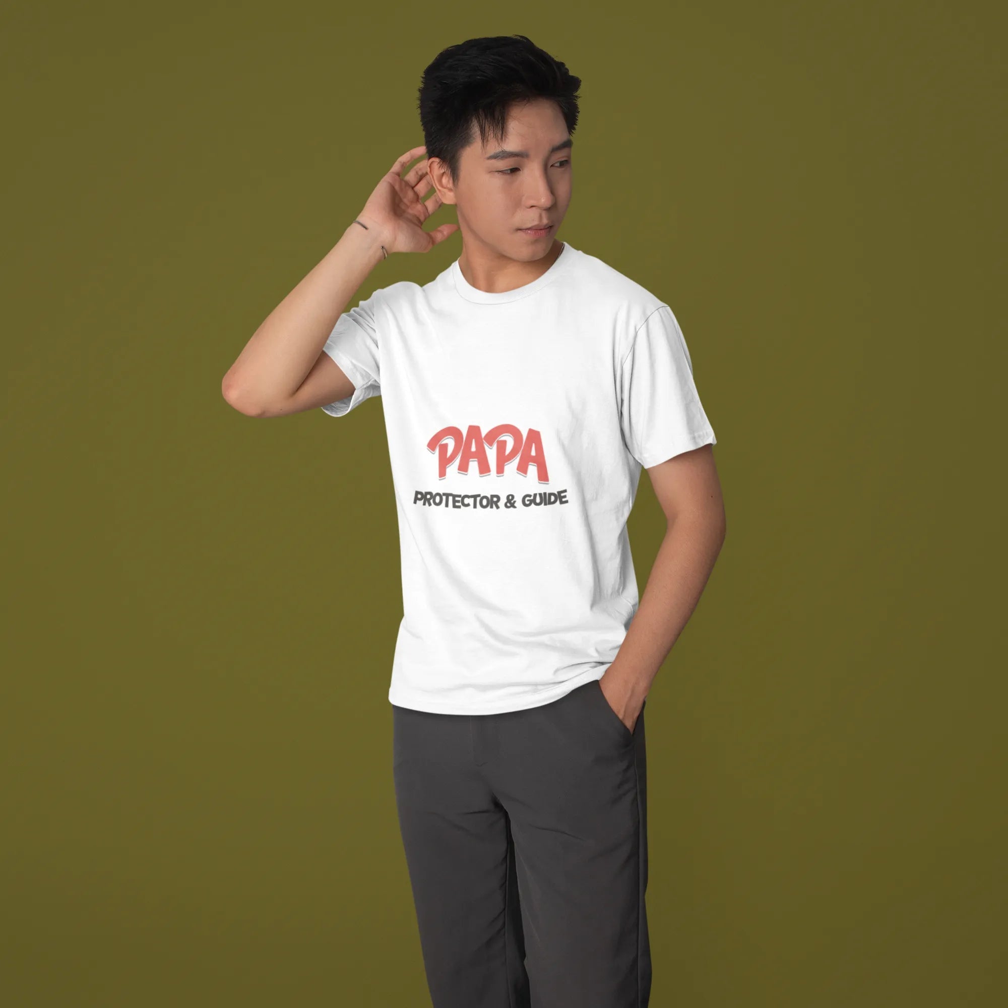 Person wearing a white t-shirt with red text on a green background