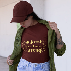 Person wearing a maroon t-shirt with 'different doesn't mean wrong' text and a green jacket.