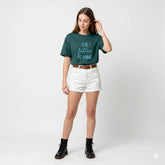 Woman wearing a green t-shirt with 'The future is mine' text on a white background
