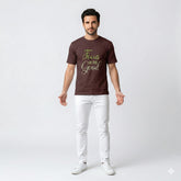 Man wearing a brown t-shirt with 'Focus on the Good' text on a white background