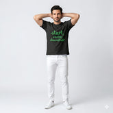 Man wearing a black t-shirt with green text on a white background