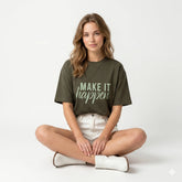Woman wearing a green t-shirt with 'MAKE IT HAPPEN' text on a white background