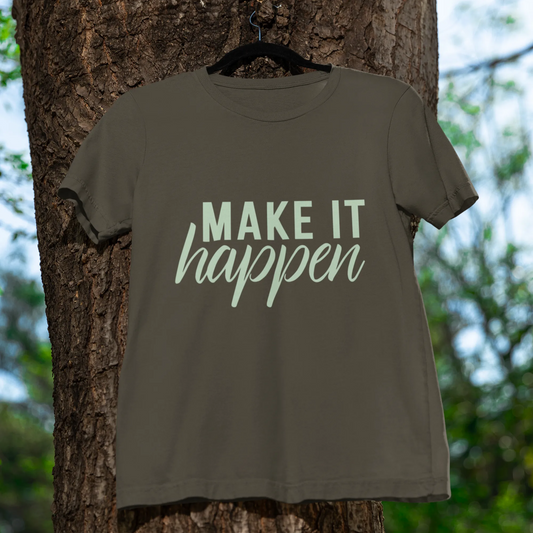 Green t-shirt with 'MAKE IT HAPPEN' text hanging on a tree