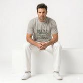 Person wearing a gray t-shirt with 'Better Things Are Coming' text against a bamboo background