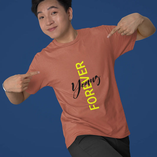 Person wearing a pink t-shirt with 'Yummy Forever' text on a blue background