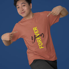 Person wearing a pink t-shirt with 'Yummy Forever' text on a blue background