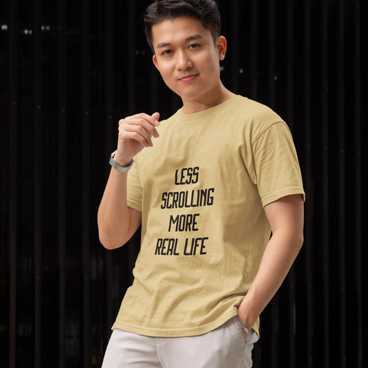 Person wearing a yellow t-shirt with text, standing against a dark background