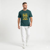 Man wearing a green t-shirt with motivational text on a white background