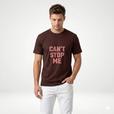 Man wearing a brown t-shirt with 'CAN'T STOP ME' text on a white background