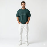 Man wearing a green t-shirt with 'Stay True' text on a white background