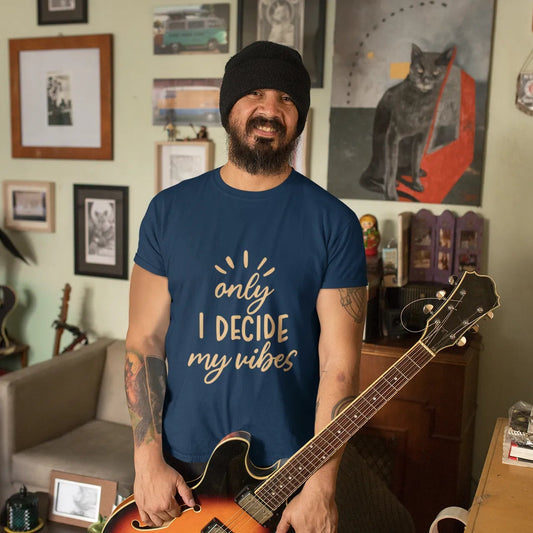 Man holding a guitar in a room with various decorations on the walls.