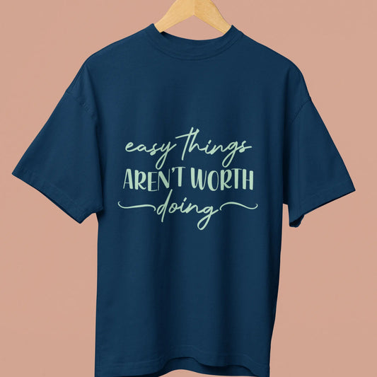 Navy blue t-shirt with white text on a beige background