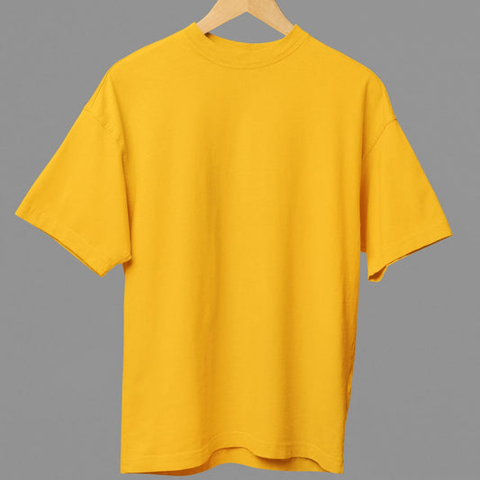 Yellow t-shirt on a hanger against a gray background