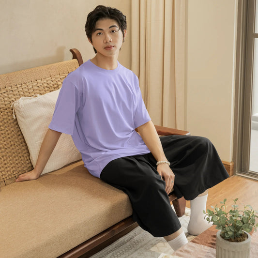 Person sitting on a couch in a cozy living room