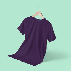 Purple t-shirt on a hanger against a light green background