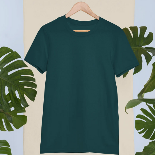 Green t-shirt on a hanger with leaf decorations