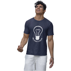 Man wearing a navy blue t-shirt with a light bulb graphic and text on a white background