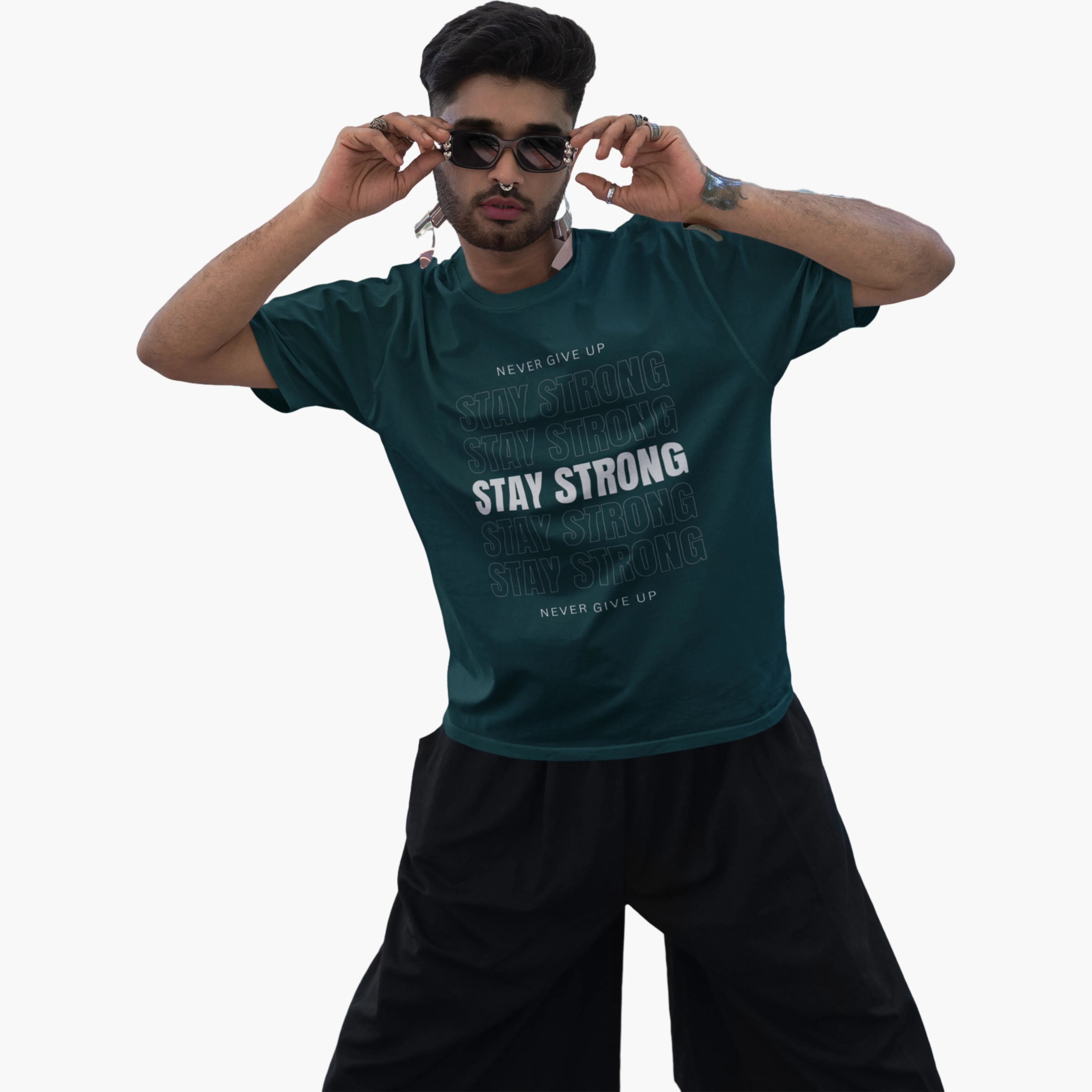 Man wearing a green t-shirt with motivational text on a white background