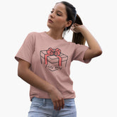 Woman wearing a pink t-shirt with a gift box design on a white background