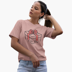 Woman wearing a pink t-shirt with a gift box design on a white background