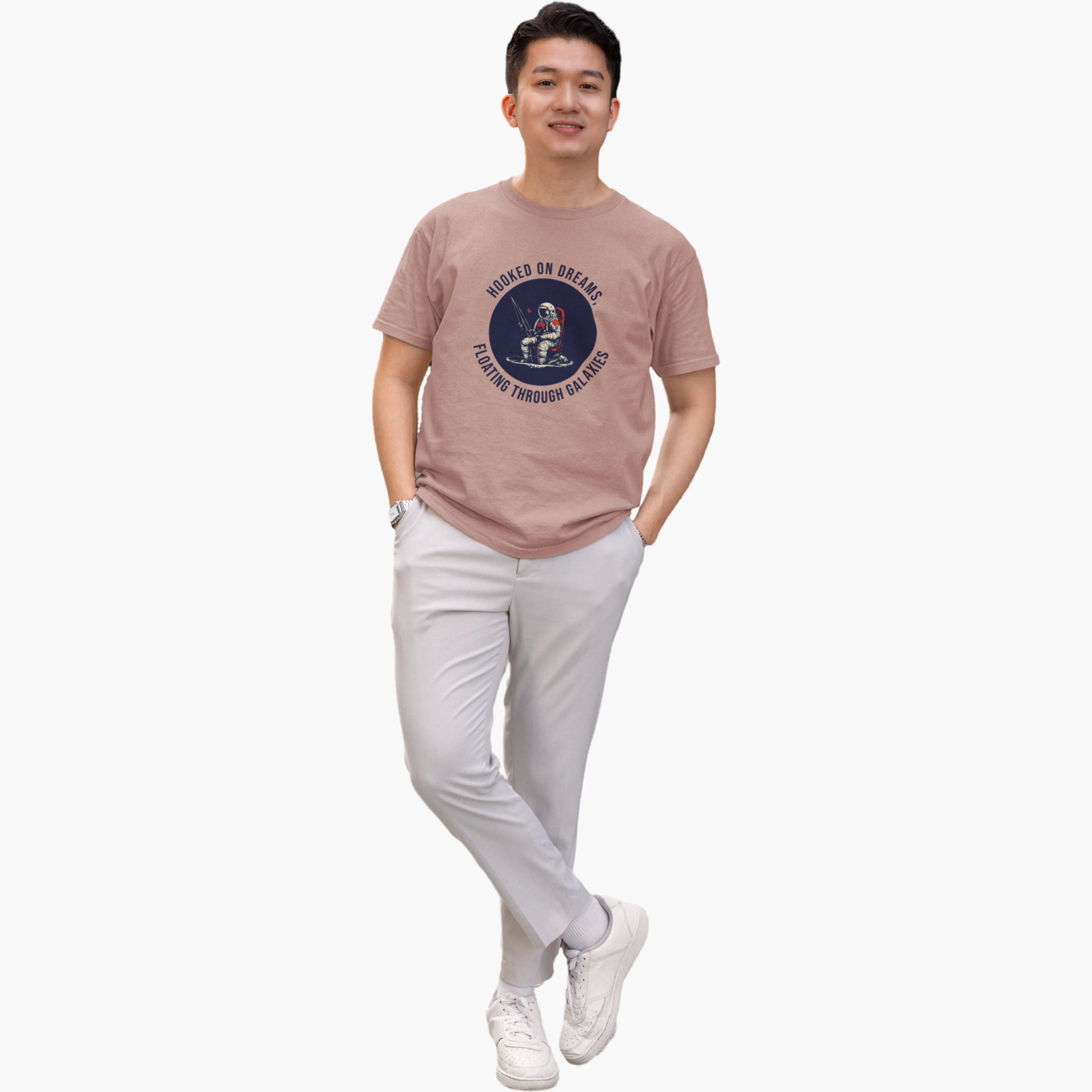 Man wearing a brown t-shirt with a graphic design on a white background