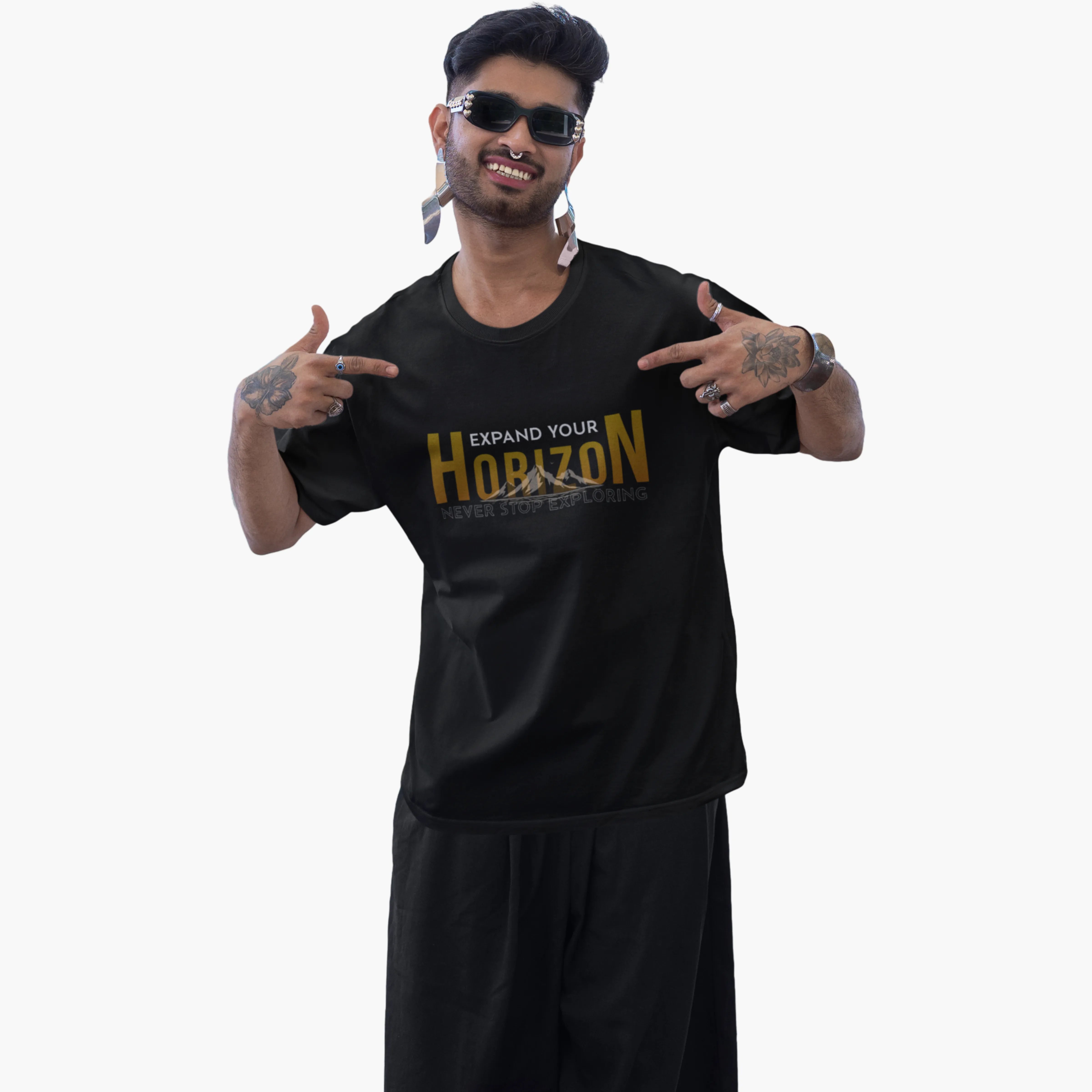 Man wearing a black t-shirt with 'Expand Your Horizon' text on a white background