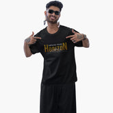 Man wearing a black t-shirt with 'Expand Your Horizon' text on a white background