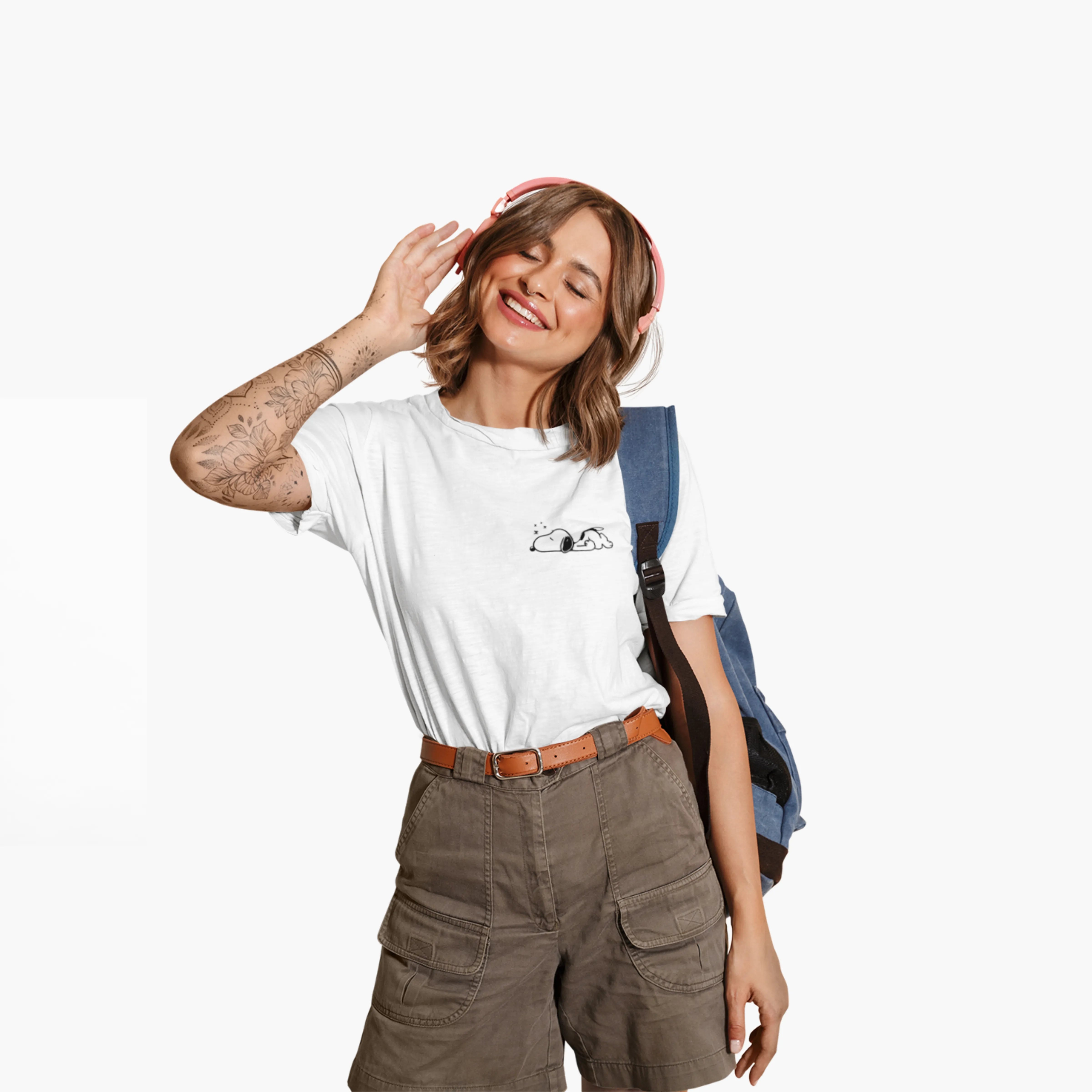 Woman wearing a white t-shirt with a logo, brown shorts, and a blue backpack on a white background