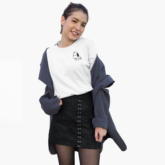 Woman wearing a white sweatshirt with a design and a black skirt on a white background
